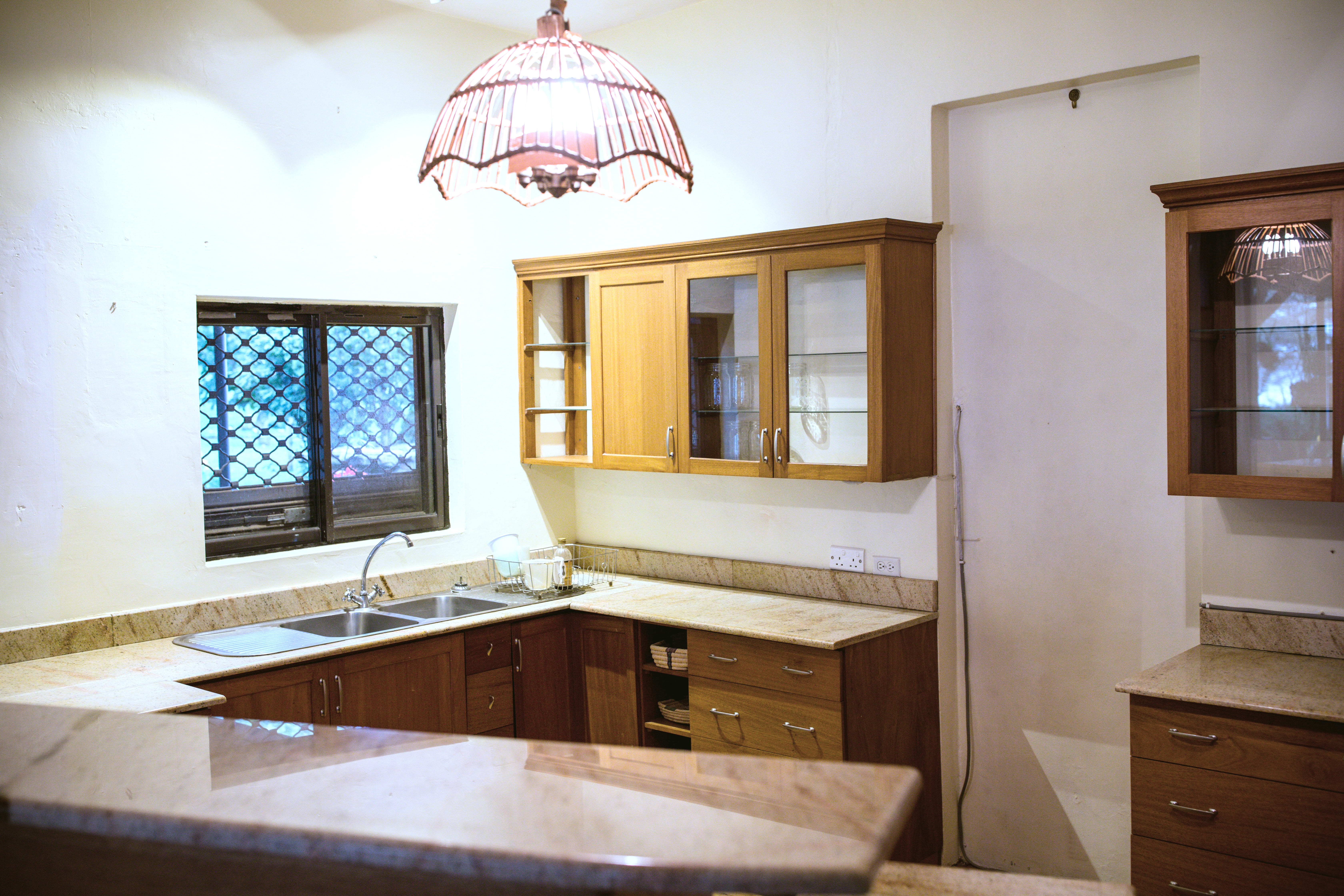 Modern modular kitchen with white cabinets and wooden accents